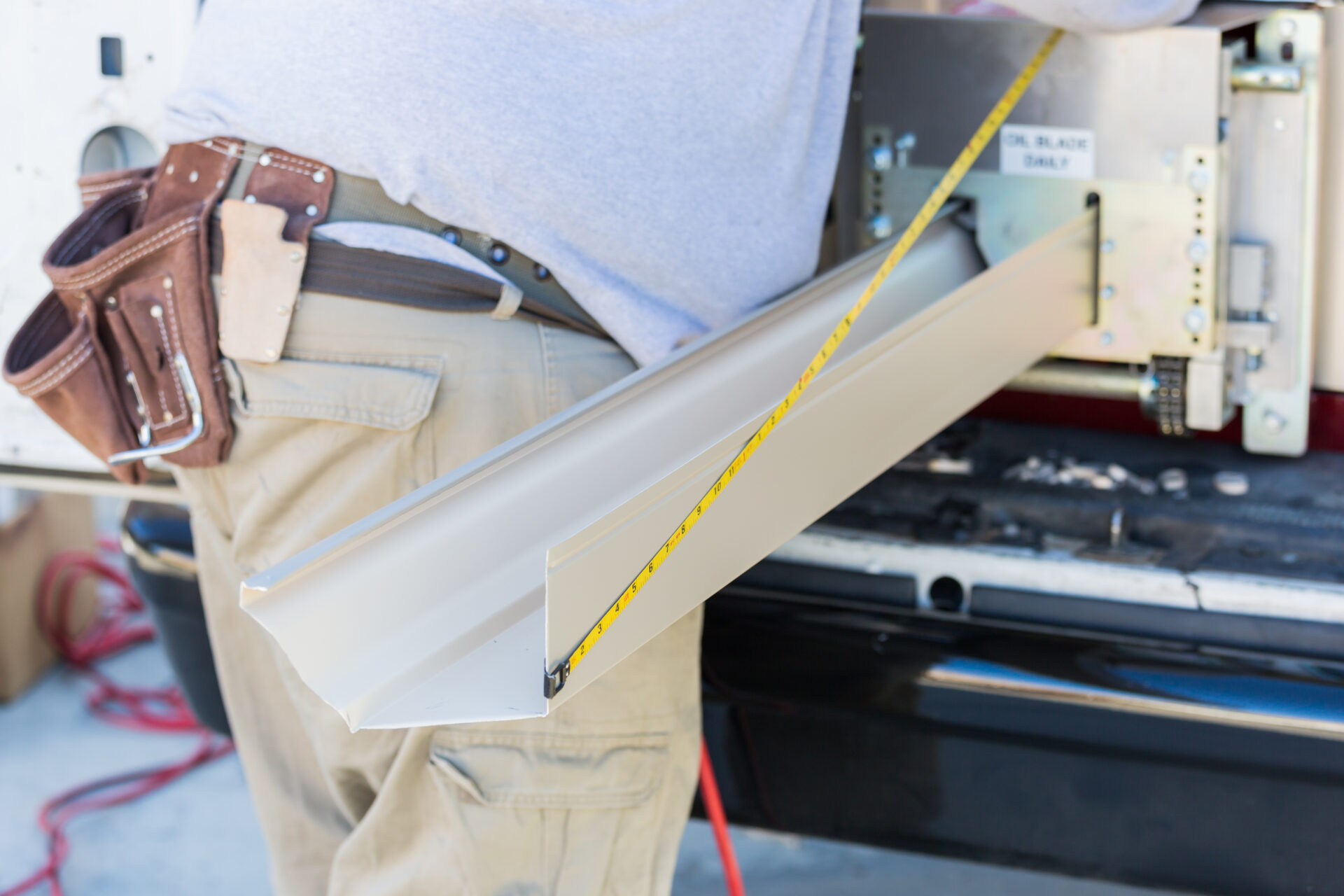 Seamless gutters inside gutter rolling machine.